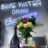 "Save Water Drink Champagne" LED Neonschild